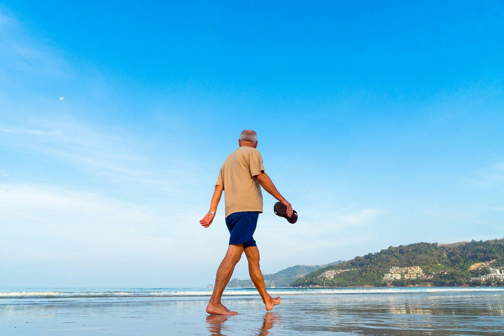 man walking on the beach