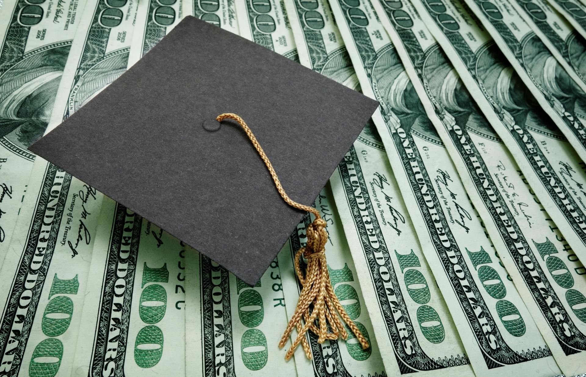 cash with a graduation cap on top