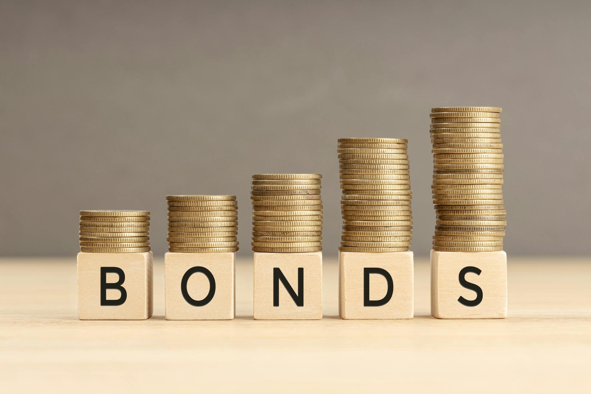 stacked change on top of the word bonds