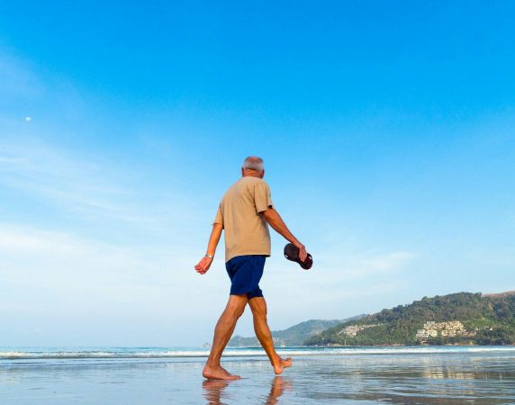 man walking on the beach